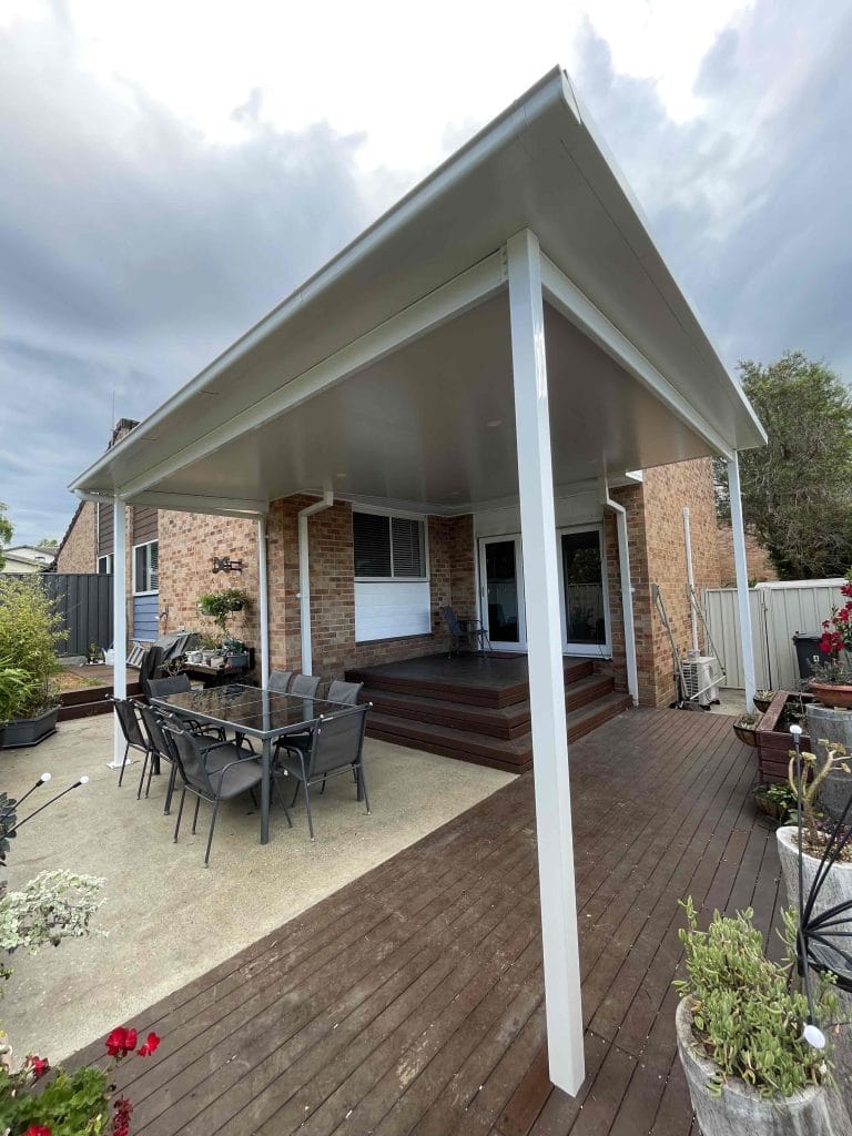 covered timber pergola with dining area by pergola builders Wollongong
